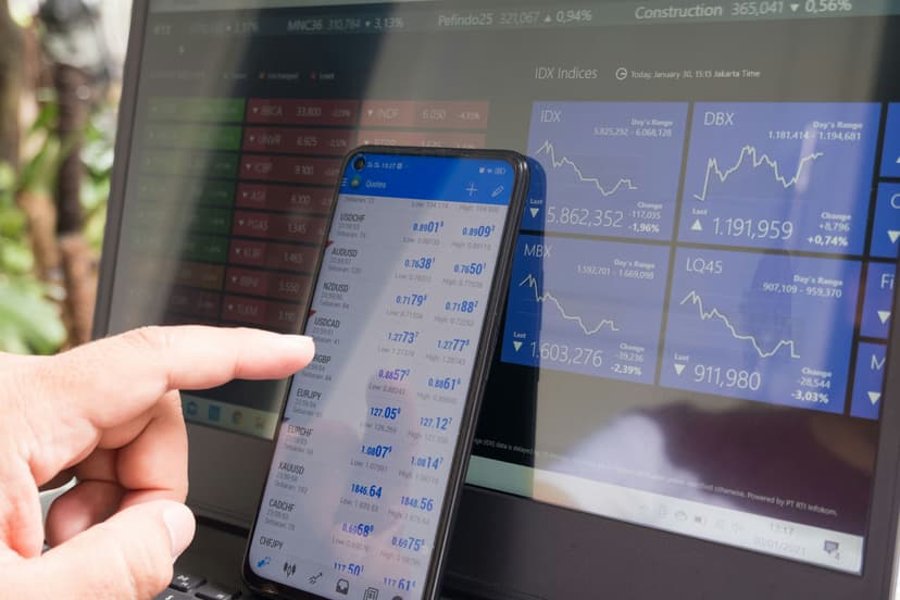 Checking live market data on a phone and laptop